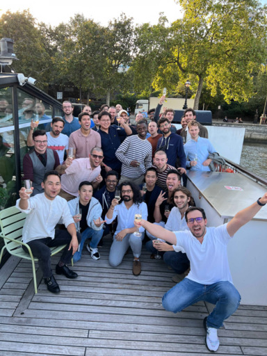 Group photo of diverse individuals in casual clothing.