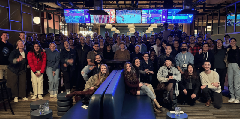 Group photo of diverse individuals in casual clothing.
