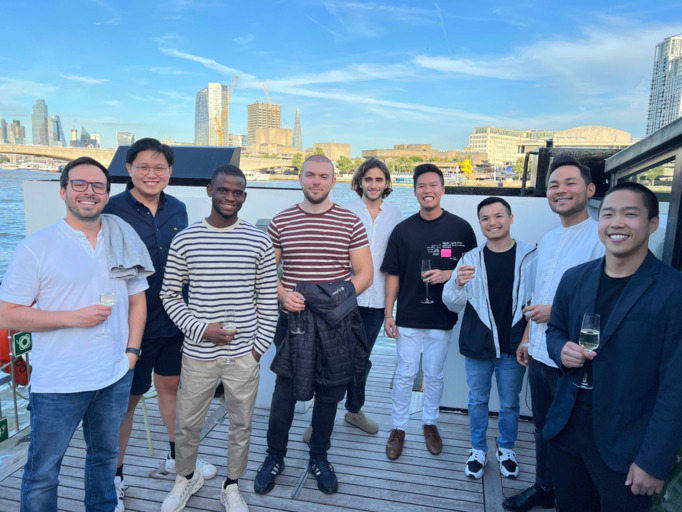 Group photo of diverse individuals in casual clothing.